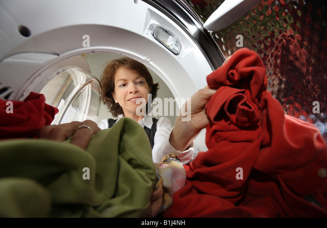 deu-germany-woman-takes-dry-laundry-out-