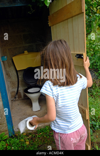 Toilet, Outside Toilet, Girl Using An Outdoor Toilet Stock Photo ...